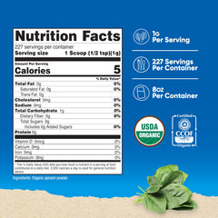 Nutricost Organic Spinach Powder scoop beside bottle for easy portioning.