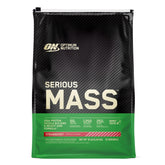 Optimum Nutrition Serious Mass strawberry powder container on a shelf, ready for a calorie-rich shake.