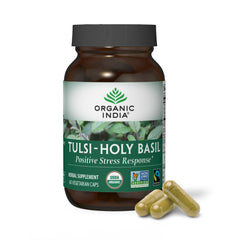 ORGANIC INDIA Tulsi Capsules bottle on a wooden surface suggesting daily stress support