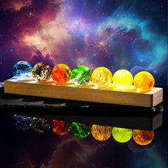 Ornalrist 7 chakra crystal spheres glow with LED base for meditation ambiance.
