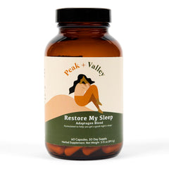 Peak + Valley natural sleep aid bottle on nightstand promotes a calm bedtime routine.