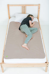 PeapodMats bedmat sand flatlay showing secure, reusable protection