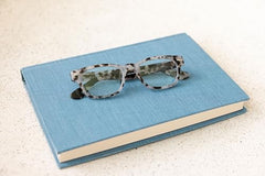 Peepers by PeeperSpecs Clark blue light blocking reading glasses lenses close-up with anti-scratch coating.