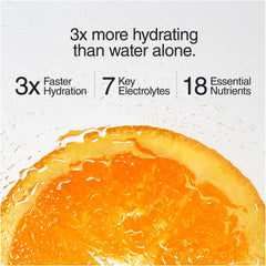 Phizz glass with orange fizz after adding tablet, a tasty hydration moment.