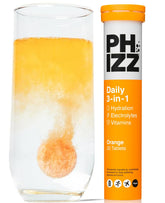 Phizz orange effervescent tablet dissolving in water for quick hydration and energy support.