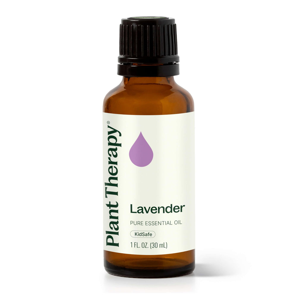 Plant Therapy Lavender oil bottle on wood surface for calming aromatherapy.