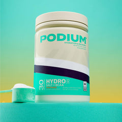 Podium Nutrition Hydro + Salt glass shows refreshing Peach Mango hydration