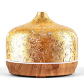 Porseme 500ml glass diffuser with gold-plated cover enhances elegant aromatherapy ambiance.