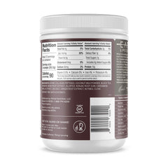 Primal Kitchen chai tea collagen powder being stirred into a mug for a dairy-free latte