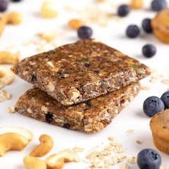 Close-up of Probar MEAL Bar Blueberry Muffin with oats and nuts for sustained energy.