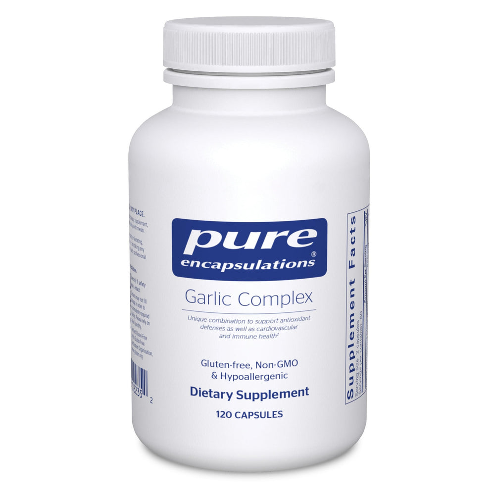 Pure Encapsulations Garlic Complex bottle on a kitchen counter for daily immune support.