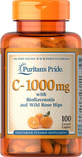 Puritan's Pride 1000 mg vitamin C bottle with capsules for daily antioxidant support.