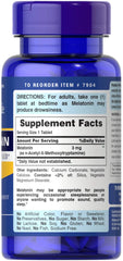 Puritan's Pride melatonin tablets label close-up highlighting vegetarian ingredients and sleep support.