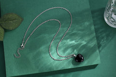 QINJIEJIE black obsidian heart pendant worn as versatile daily accessory for focus
