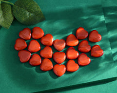 QINJIEJIE red jasper heart stone held for meditation and balance.