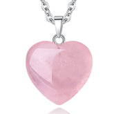 QINJIEJIE Rose Quartz Heart pendant close-up, smooth surface ideal for meditation and balance.