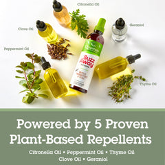 Travel-size Quantum Health Buzz Away Extreme bottle beside essentials