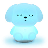 RAINLAX Mindfulness Breathing Puppy glows softly on a nightstand for calm evenings.