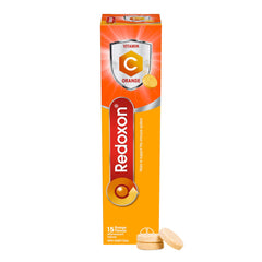 Redoxon Orange tablets poured into a glass for a refreshing vitamin C boost