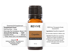 REVIVEEO Copaiba essential oil in diffuser setup creates a soothing aromatic atmosphere.