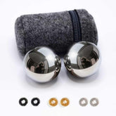 Roadtofree chiming Baoding ball in palm for calming focus.