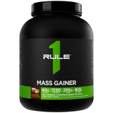 Rule 1 Mass Gainer shake in a glass emphasizing calorie-dense energy for weight gain goals.