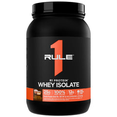 Rule 1 Proteins R1 Whey Isolate bottle on counter, fast-acting protein for post-workout recovery.