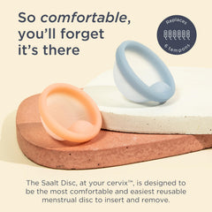 Saalt Disc Duo being inserted with finger notch for easy removal and comfort.