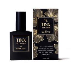 SAINT JANE Tinx Elixir Intimacy Oil bottle highlights luxe water-based hydration
