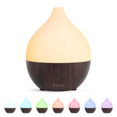 SALKING essential oil diffuser in dark wood front view releasing a gentle mist for small spaces.
