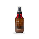 Salt Lab Magnesium Oil Spray on skin for quick absorption and daily relaxation.
