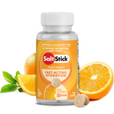 SaltStick FastChews orange tablet in hand for quick hydration during workouts.