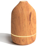 Salubrito essential oil diffuser wood grain close-up for a calming space.
