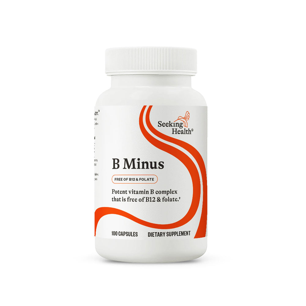 Seeking Health B-Minus bottle pour demonstrates easy daily dosing for energy support.