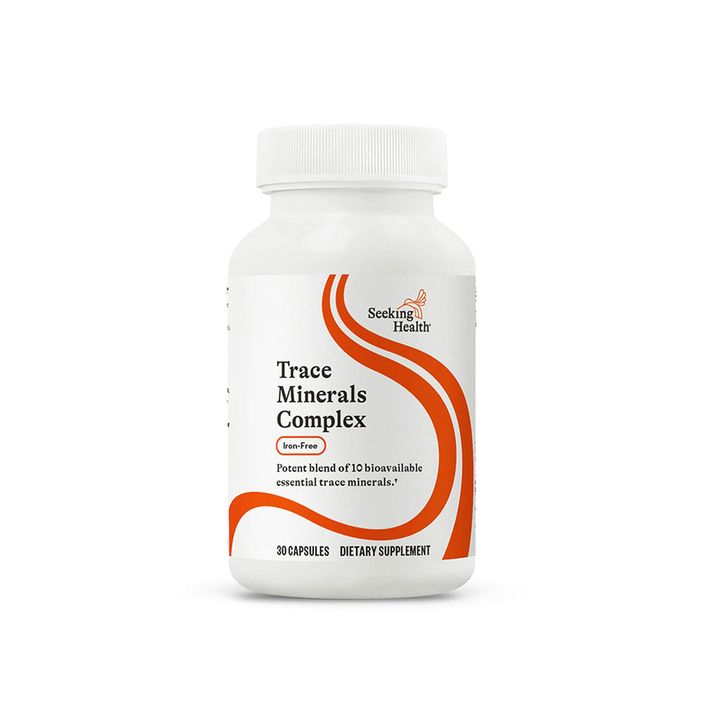 Seeking Health Trace Minerals Complex bottle on desk with potential immune support.