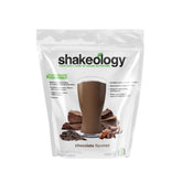 Shakeology chocolate plant-based protein tub front view highlighting gluten-free formula.