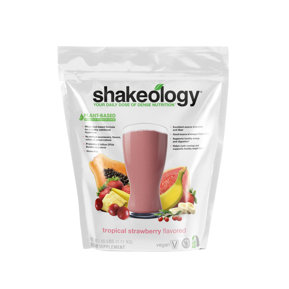 Shakeology Tropical Strawberry tub highlighting gluten-free vegan protein for balanced nutrition.