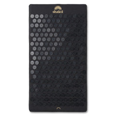 ShaktiMat Premium Acupressure Mat in Shakti Black, top view, promotes muscle relaxation.