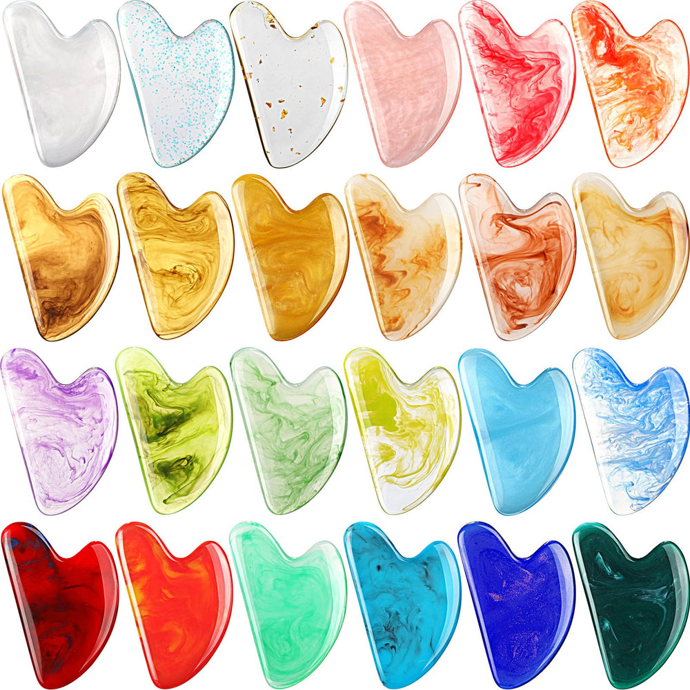 Sherr heart-shaped resin gua sha tool collection for facial massage and skin toning.
