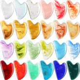 Sherr heart-shaped resin gua sha tool collection for facial massage and skin toning.