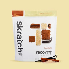 Skratch Labs horchata in glass during cooldown, signaling refreshing hydration after training.