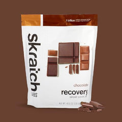 Skratch Labs recovery drink chocolate mixing glass ready for blend