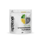 Skratch Labs Unsweetened Hydration lemon lime powder dissolving in water for steady electrolytes.
