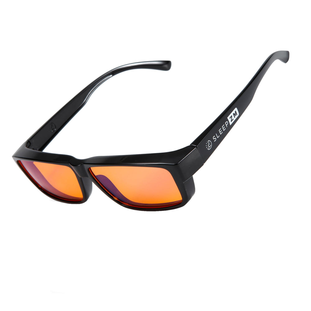 Sleep ZM amber-lens blue light glasses close-up highlighting blue light filter for evening use.