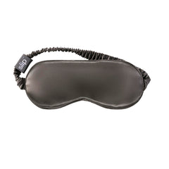 SLIP sleep mask shown with eyes closed delivering complete light blockage for restful sleep.