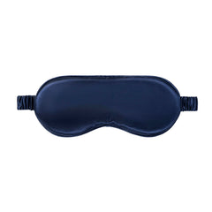SLIP Pure Silk Sleep Mask Navy worn over eyes to block light for restful sleep.