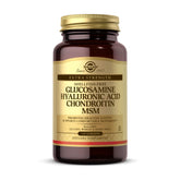 Solgar glucosamine-hyaluronic-acid-chondroitin-msm tablets being poured for joint support