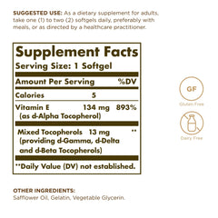 Solgar Vitamin E 200 IU bottle close-up showing gluten-free and dairy-free supplement.