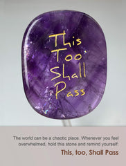 Close-up of carved This Too Shall Pass on amethyst