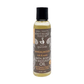 Soothing Touch sandalwood bath oil bottle for a relaxing ritual.